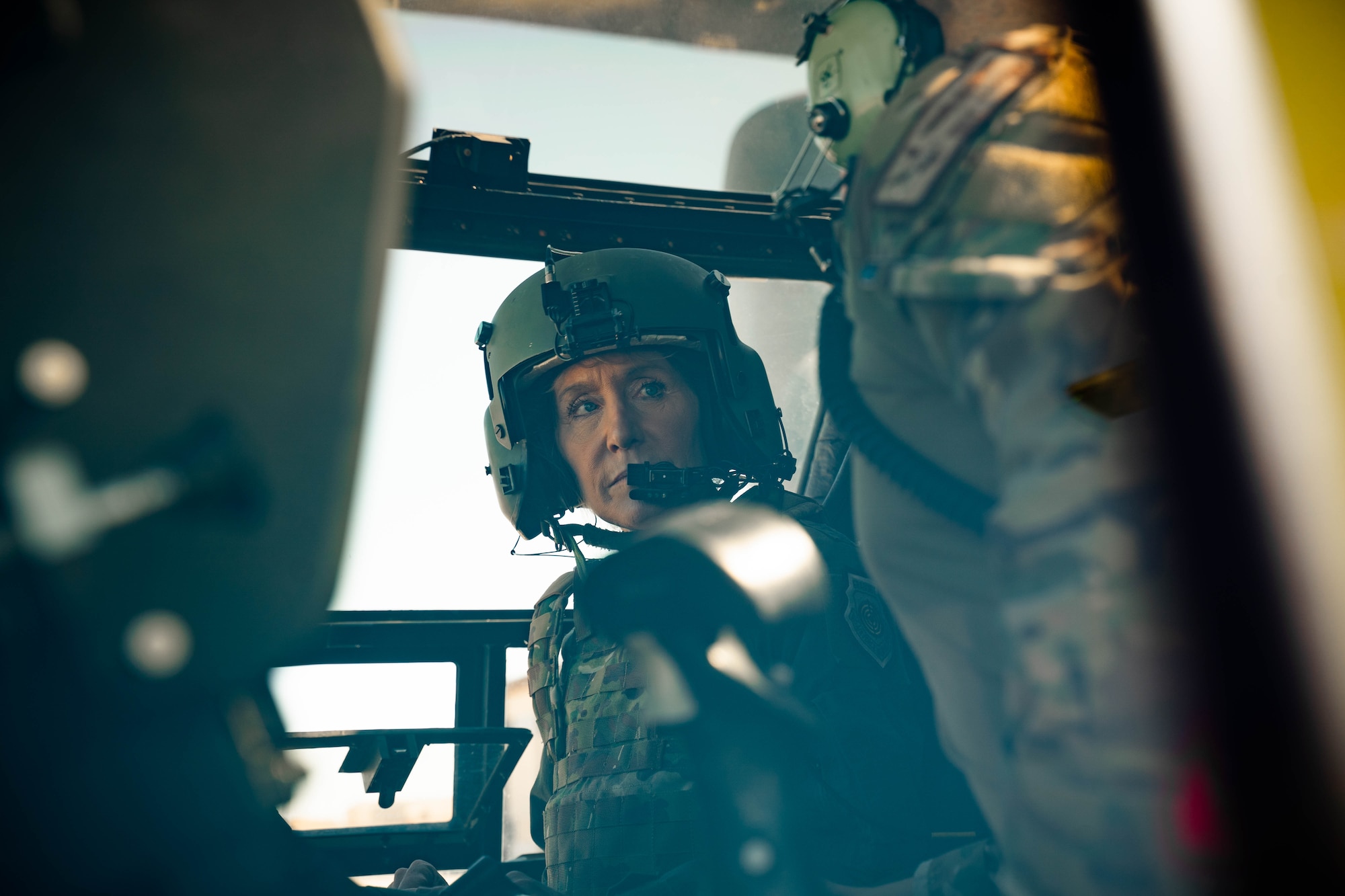 Maj. Gen. Jeannie M. Leavitt looks over in the cockpit of a CV-22 Osprey