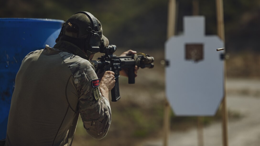 A British Royal Marines Commando assigned to 40 Commando, currently attached to the 15th Marine Expeditionary Unit, engages a target during a shooting drill as part of a close quarters tactics enablers course at Marine Corps Base Camp Pendleton, California, July 13, 2023. During the CQTE course, instructors from Expeditionary Operations Training Group, I Marine Expeditionary Force, trained 15th MEU and British Royal Marines on detainee handling, urban operations, enhanced marksmanship proficiency, and squad tactics. (U.S. Marine Corps photo by Cpl.  Helms)