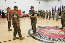 U.S. Marine Corps Lt. Gen. Brian W. Cavanaugh, Commanding General, Fleet Marine Force, Atlantic, Commander, Marine Forces Command (MARFORCOM), Marine Forces Northern Command, center left, transfers the non-commissioned officer sword to appoint the new Command Sergeant Major at the Command Sergeant Major Relief and Appointment Ceremony, Camp Elmore, Norfolk, VA, Aug 4, 2023. During the ceremony, Sgt. Maj. Michael J. Prichard, left, was formally relieved of his post as Command Sergeant Major by Cavanaugh, who then appointed Sgt. Maj. Aaron G. McDonald, center right, through a symbolic transfer of the non-commissioned officer sword. The U.S. Marine Corps Command Sgt. Maj. role serves as the principal enlisted advisor for a senior Marine commander, making high level strategic decisions that impact the entire Marine Corps.