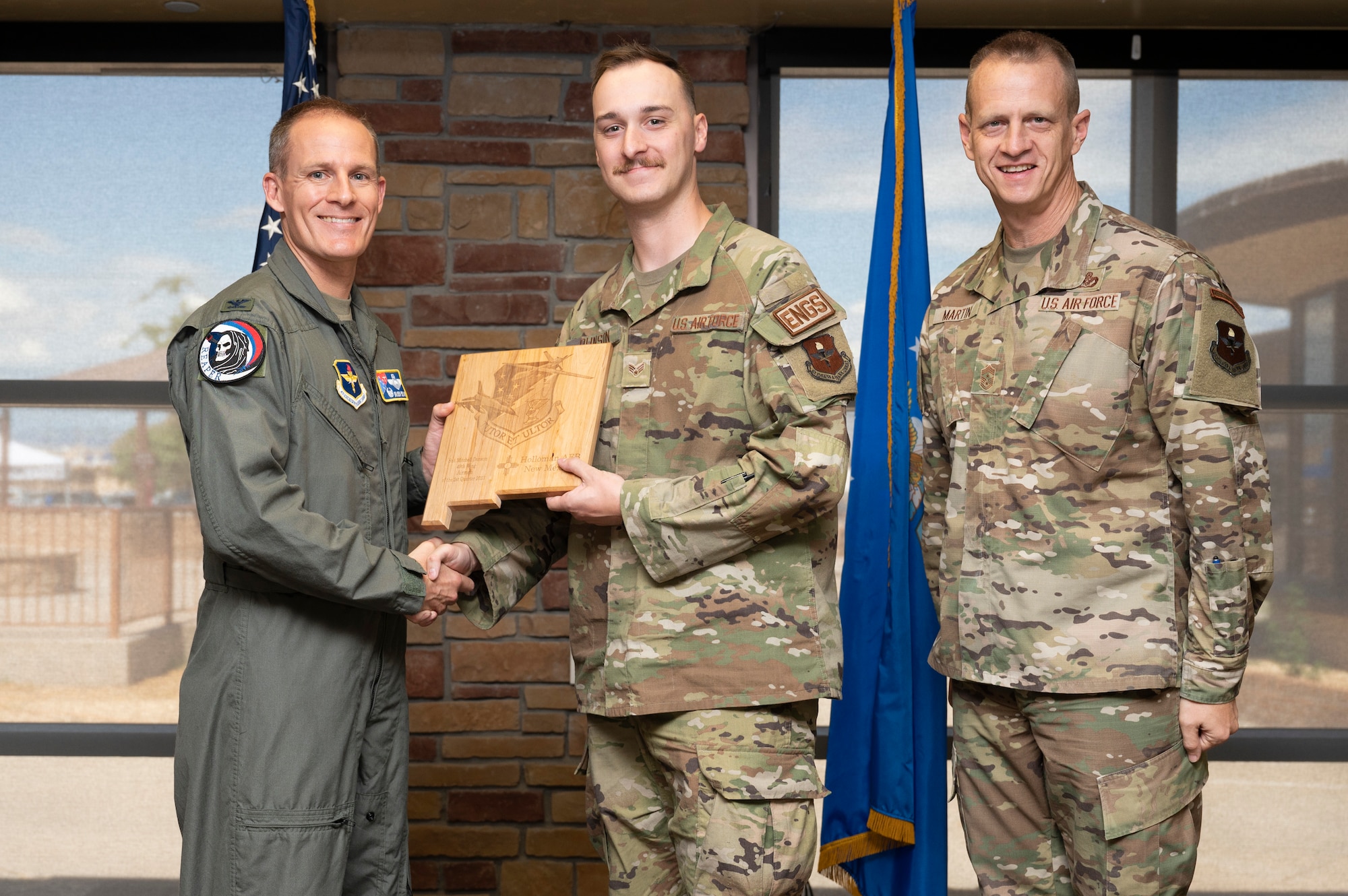 U.S. Air Force Senior Airman Mitchell Dunson, from the 49th Component Maintenance Squadron, accepts the 49th Wing Airman of the Quarter Award, during the 49th Wing’s 2nd Quarter Award ceremony at Holloman Air Force Base, New Mexico, Aug. 11, 2023. Quarterly award winners were selected based on their technical expertise, demonstration of leadership and job performance. (U.S. Air Force photo by Airman 1st Class Michelle Ferrari)
