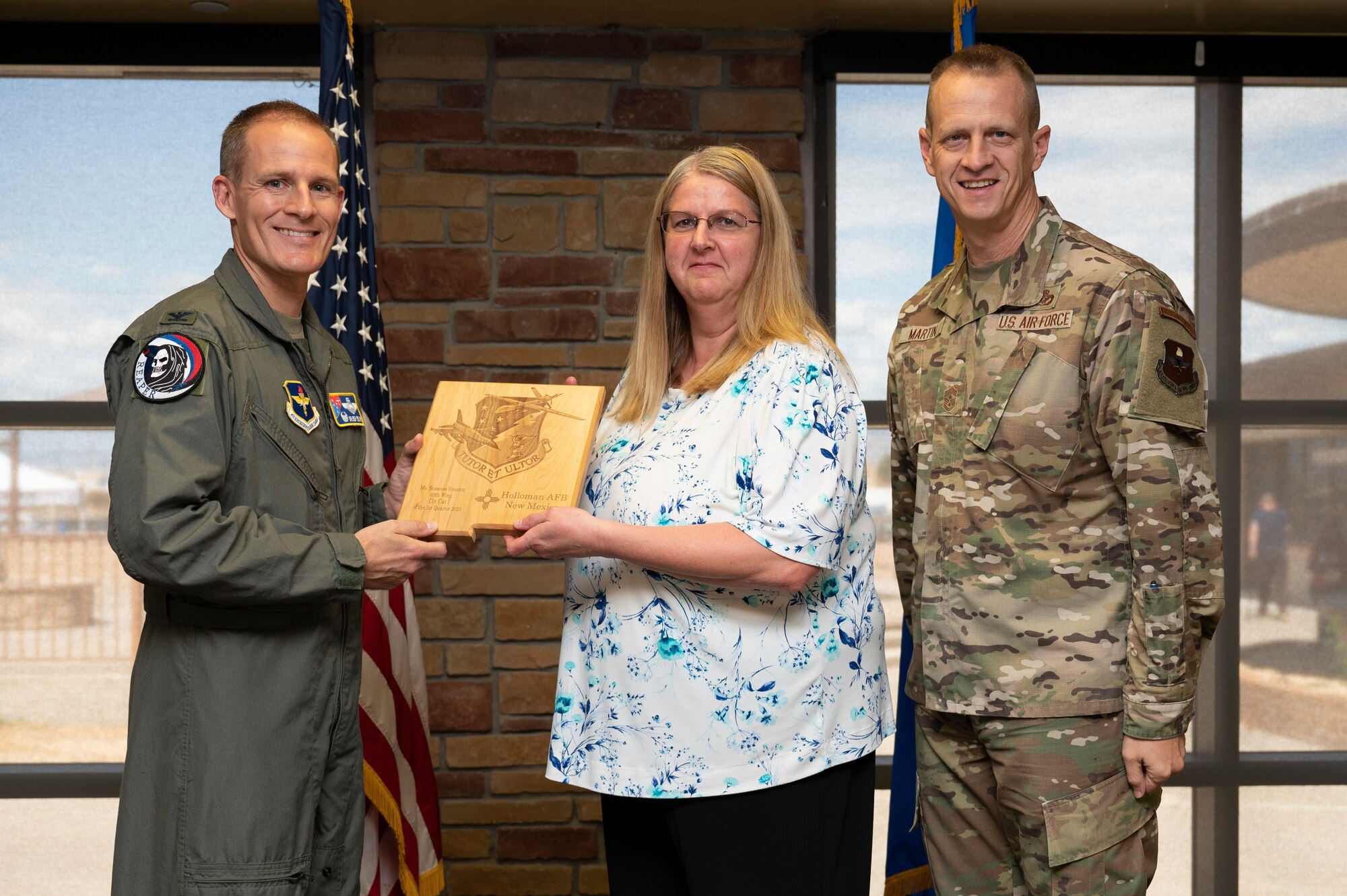 Suzanne Houston, from the 49th Logistics Readiness Squadron, accepts the 49th Wing Category I Non-Supervisory Civilian of the Quarter Award, during the 49th Wing’s 2nd Quarter Award ceremony at Holloman Air Force Base, New Mexico, Aug. 11, 2023. Quarterly award winners were selected based on their technical expertise, demonstration of leadership and job performance. (U.S. Air Force photo by Airman 1st Class Michelle Ferrari)