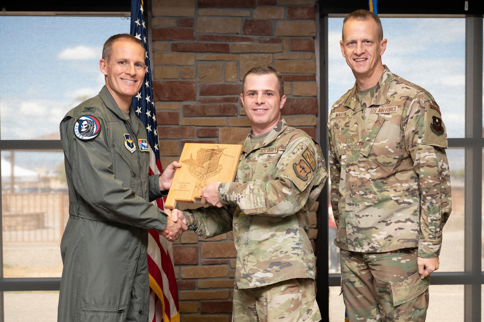 U.S. Air Force Tech. Sgt. Skylar Rudy, from the 49th Security Forces Squadron, accepts the 49th Wing’s Volunteer of the Second Quarter Award, during the 49th Wing’s 2nd Quarter Award ceremony at Holloman Air Force Base, New Mexico, Aug. 11, 2023. Quarterly award winners were selected based on their technical expertise, demonstration of leadership and job performance. (U.S. Air Force photo by Airman 1st Class Michelle Ferrari)