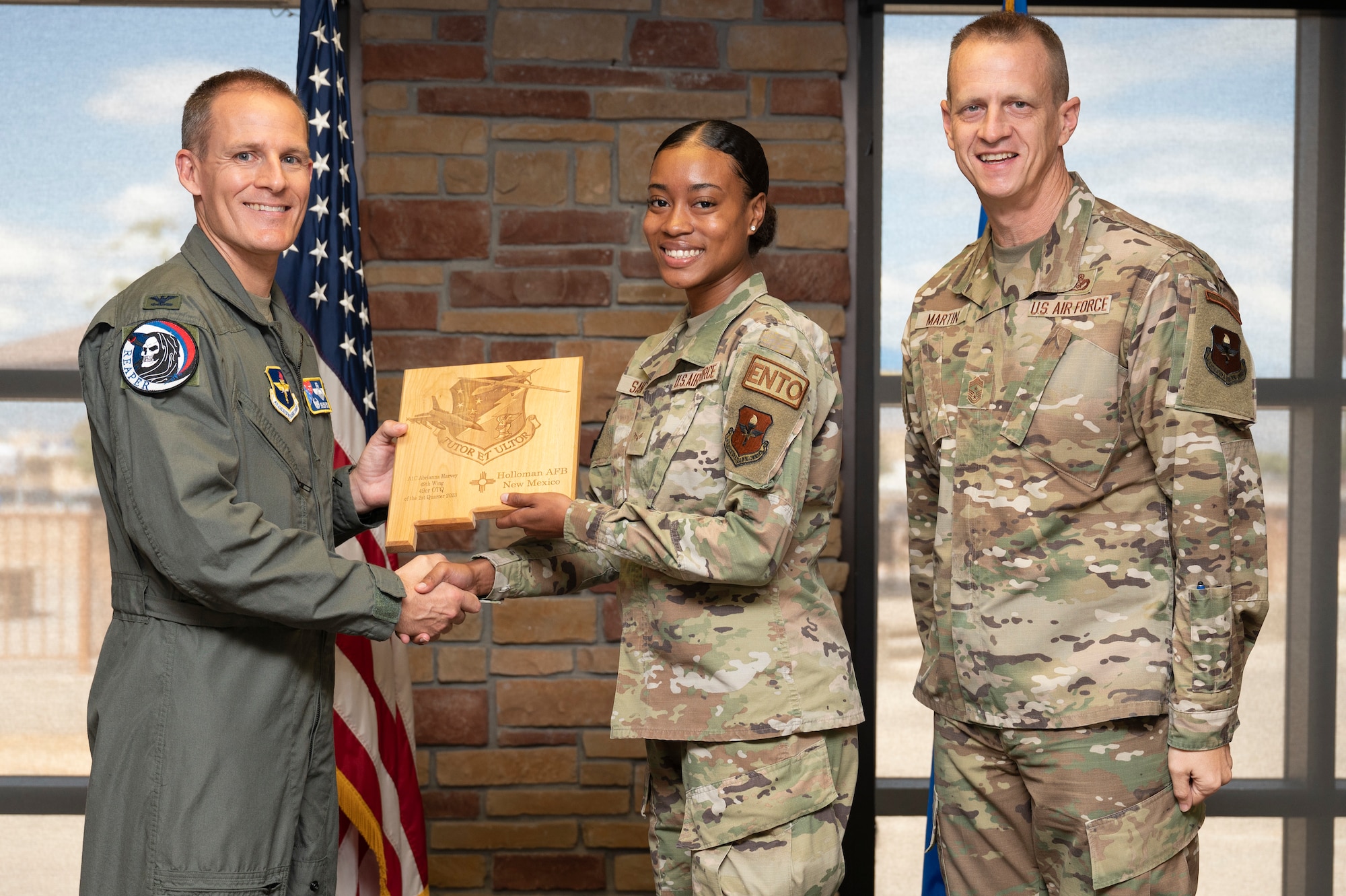 U.S. Air Force Airman 1st Class Abrianna Harvey, from the 49th Civil Engineer Squadron, accepts the 49th Wing Second Quarter 49er Award, during the 49th Wing’s 2nd Quarter Award ceremony at Holloman Air Force Base, New Mexico, Aug. 11, 2023. Quarterly award winners were selected based on their technical expertise, demonstration of leadership and job performance. (U.S. Air Force photo by Airman 1st Class Michelle Ferrari)