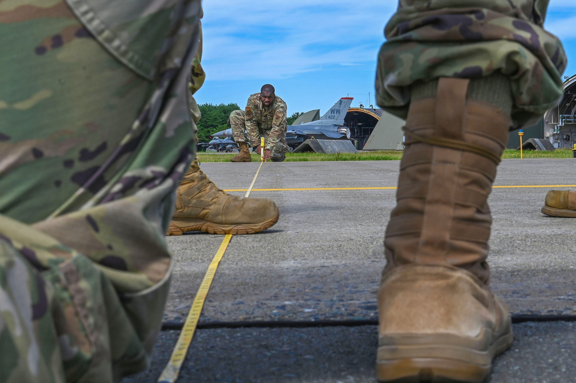 U.S. Air Force Staff Sgt. David Crowey, 87th Electronic Warfare Squadron Combat Shield avionics electronic warfare (EW) technician, takes measurements to prepare to test the AN/ASQ-213 HARM Targeting Systems at Misawa Air Base, Japan, Aug. 9, 2023. Combat Shield is responsible for assessing the defensive system readiness of Combat Air Forces (CAF) aircraft by deploying assessment teams with specialized equipment to provide senior leadership an independent assessment of the overall health of CAF systems. (U.S. Air Force photo by Staff Sgt. Ericka A. Woolever)