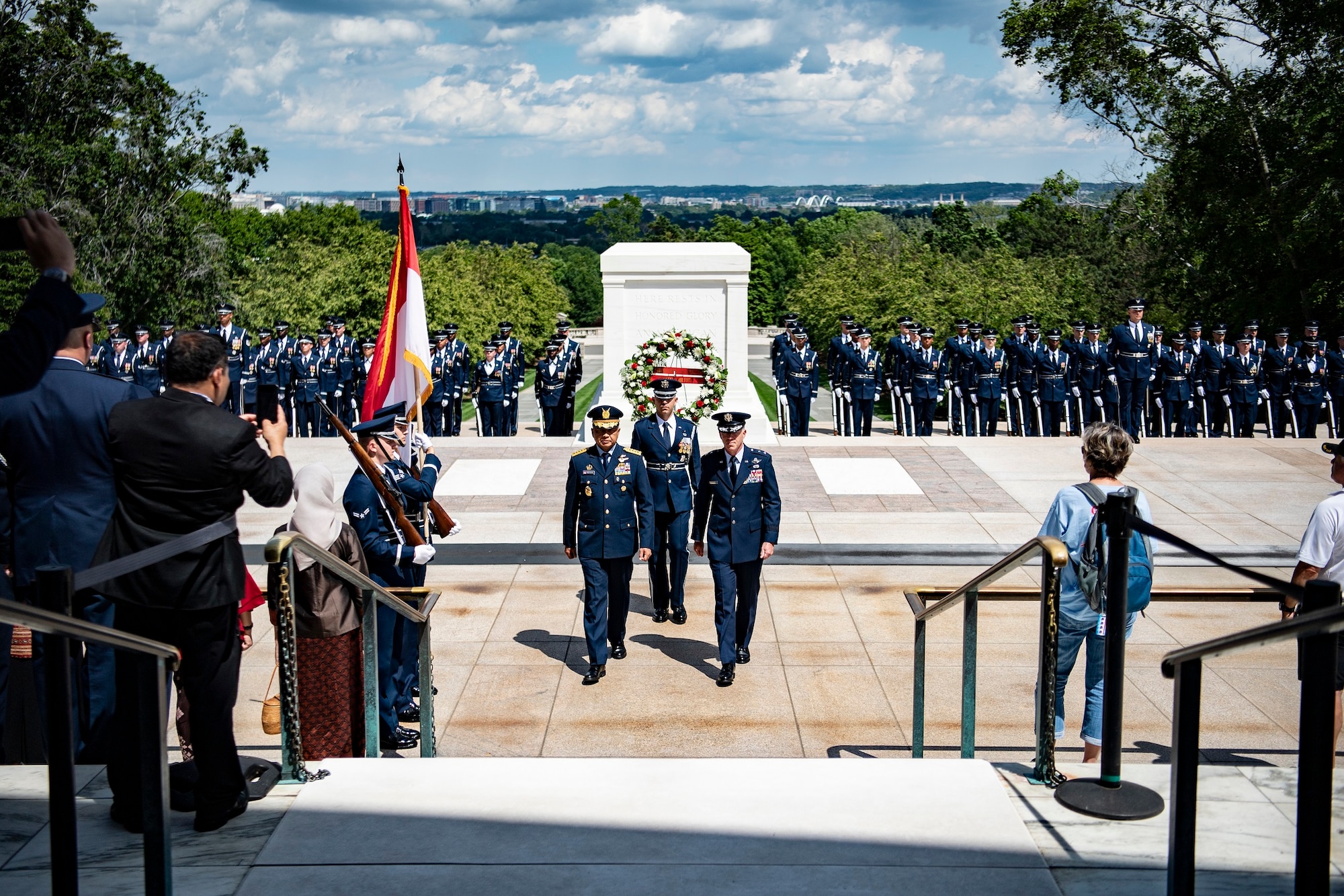 Men at Arlington National Cemetery ceremony