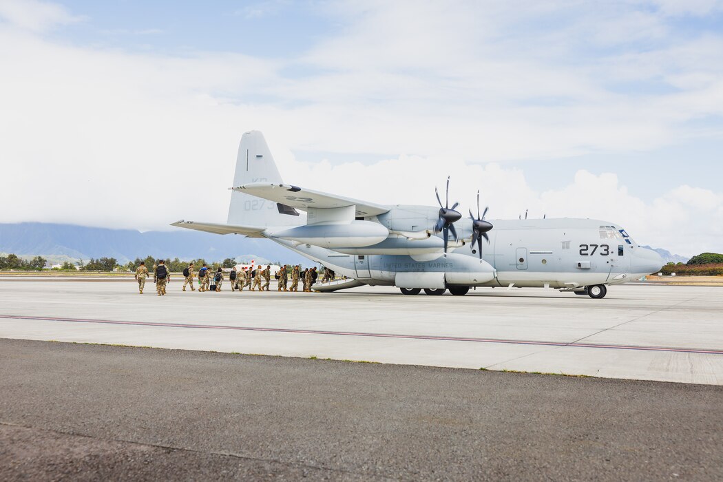 Hawaii National Guardsmen with Joint Task Force 50 board a KC-130J Hercules assigned to Marine Aerial Refueler Transport Squadron 153 (VMGR-153), Marine Aircraft Group 24, 1st Marine Air Wing, Marine Air Station Kaneohe Bay, Marine Corps Base Hawaii, Aug. 14, 2023. At the request of U.S. Army Pacific, and in accordance with U.S. federal law, Hawaii based U.S. Marines with VMGR-153 provided transportation of Joint Task Force 50 personnel and equipment from Oahu to Maui. Joint Task Force 50 is the command and control element which will coordinate DoD response efforts upon request from appropriate government authorities. (U.S. Marine Corps photo by Cpl. Brandon Aultman)