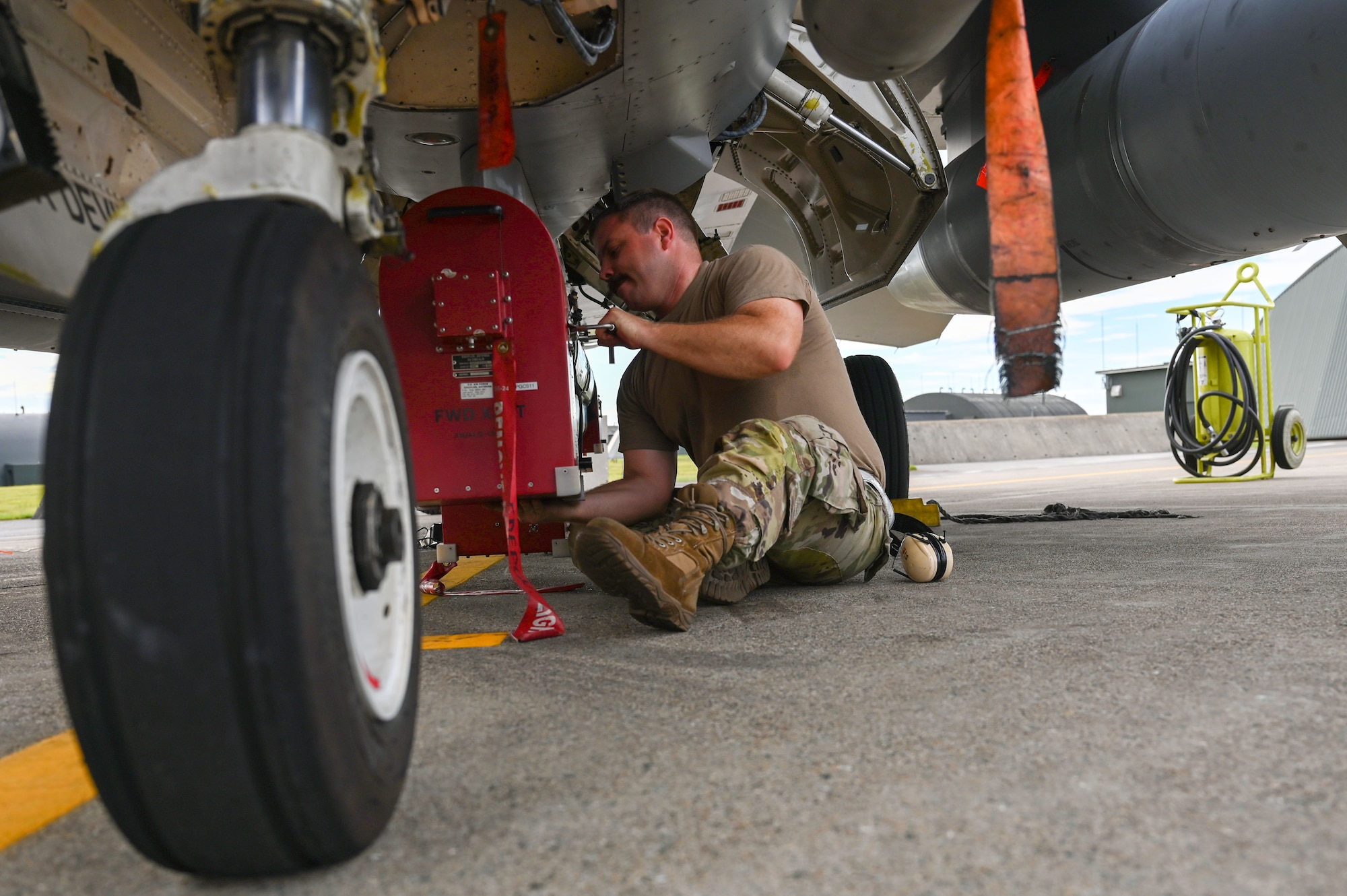 U.S. Air Force Tech. Sgt. Cody Bunderson, 87th Electronic Warfare Squadron Combat Shield flight chief, installs an AFT Transmit Coupler AN/ALQ-184 ECM Pod on a U.S Air Force F-16 Fighting Falcon at Misawa Air Base, Japan, Aug. 8, 2023. Combat Shield is responsible for assessing the defensive system readiness of Combat Air Forces (CAF) aircraft by deploying assessment teams with specialized equipment to provide senior leadership an independent assessment of the overall health of CAF systems. (U.S. Air Force photo by Staff Sgt. Ericka A. Woolever)