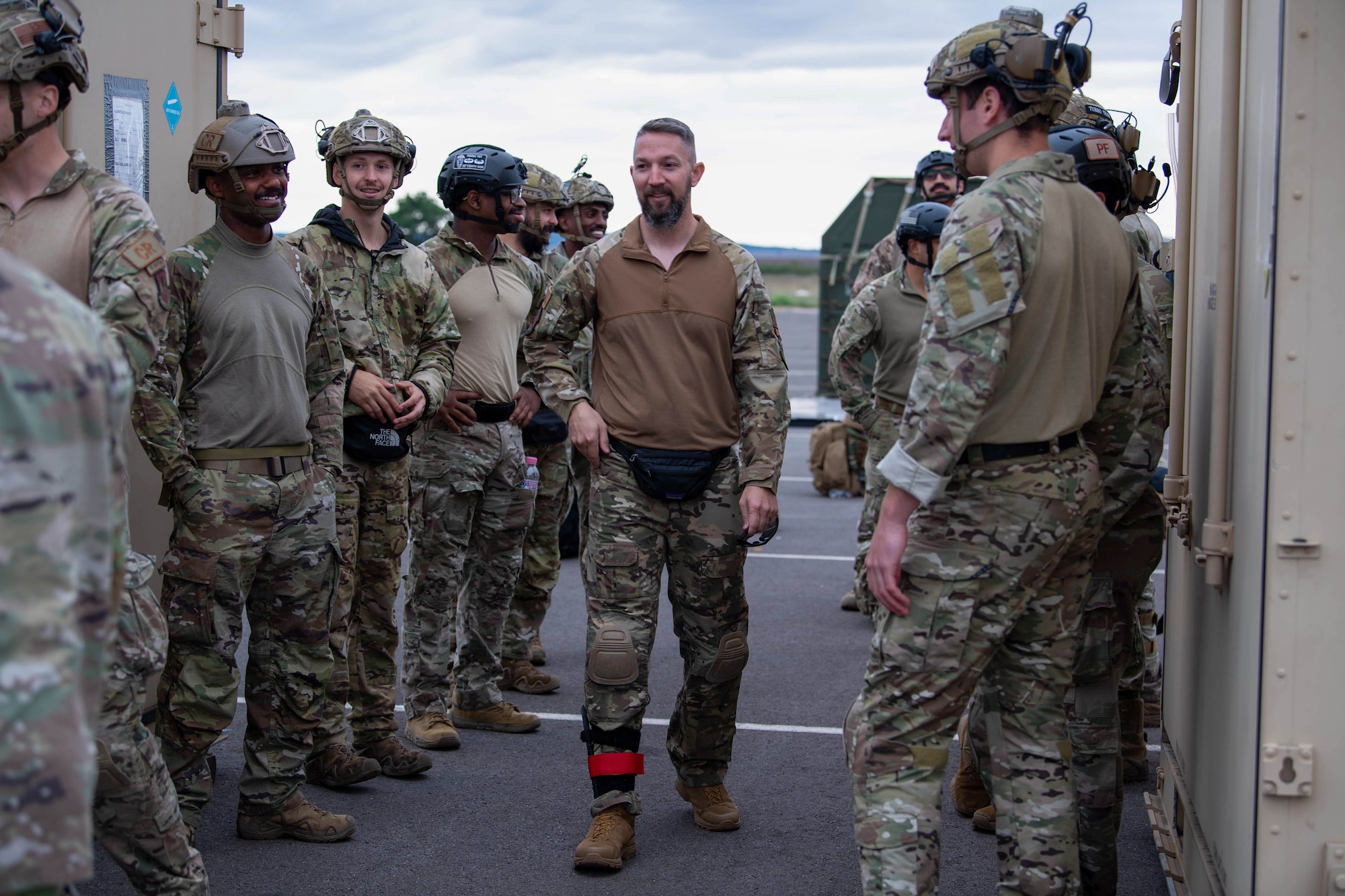 U.S. Air Force Master Sgt. Stephen Baker, 435th Contingency Response Squadron jump master, reviews jump drills and procedures with the 435 Contingency Response Group airborne assessment team and airborne first-in security team at Bezmer Air Base, Bulgaria, Aug. 8, 2023.