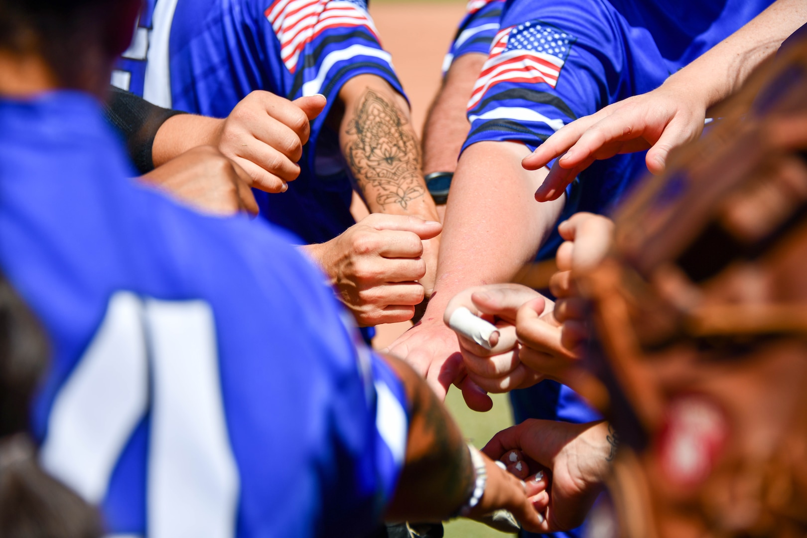 Members of the United States Air Force Women’s Softball Team form in a huddle before an Armed Forces Sports softball game at the USA Softball Hall of Fame Complex in Oklahoma City, Aug. 8, 2023. The tournament comprised all branches of the military which was held from Aug. 4-10, 2023. (U.S. Air Force photo by Airman 1st Class Miyah Gray)