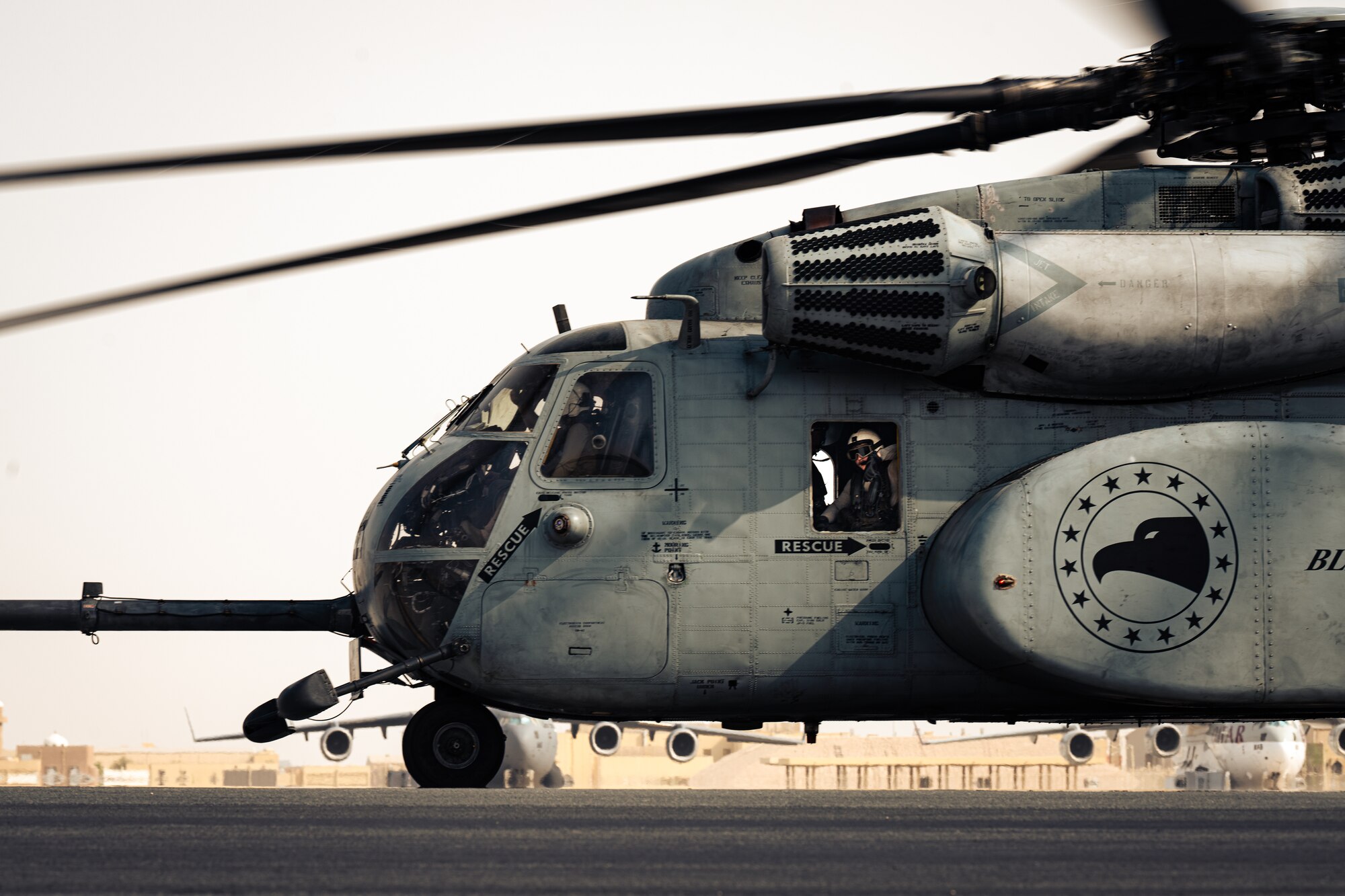 Photo of pilot taxiing a helicopter