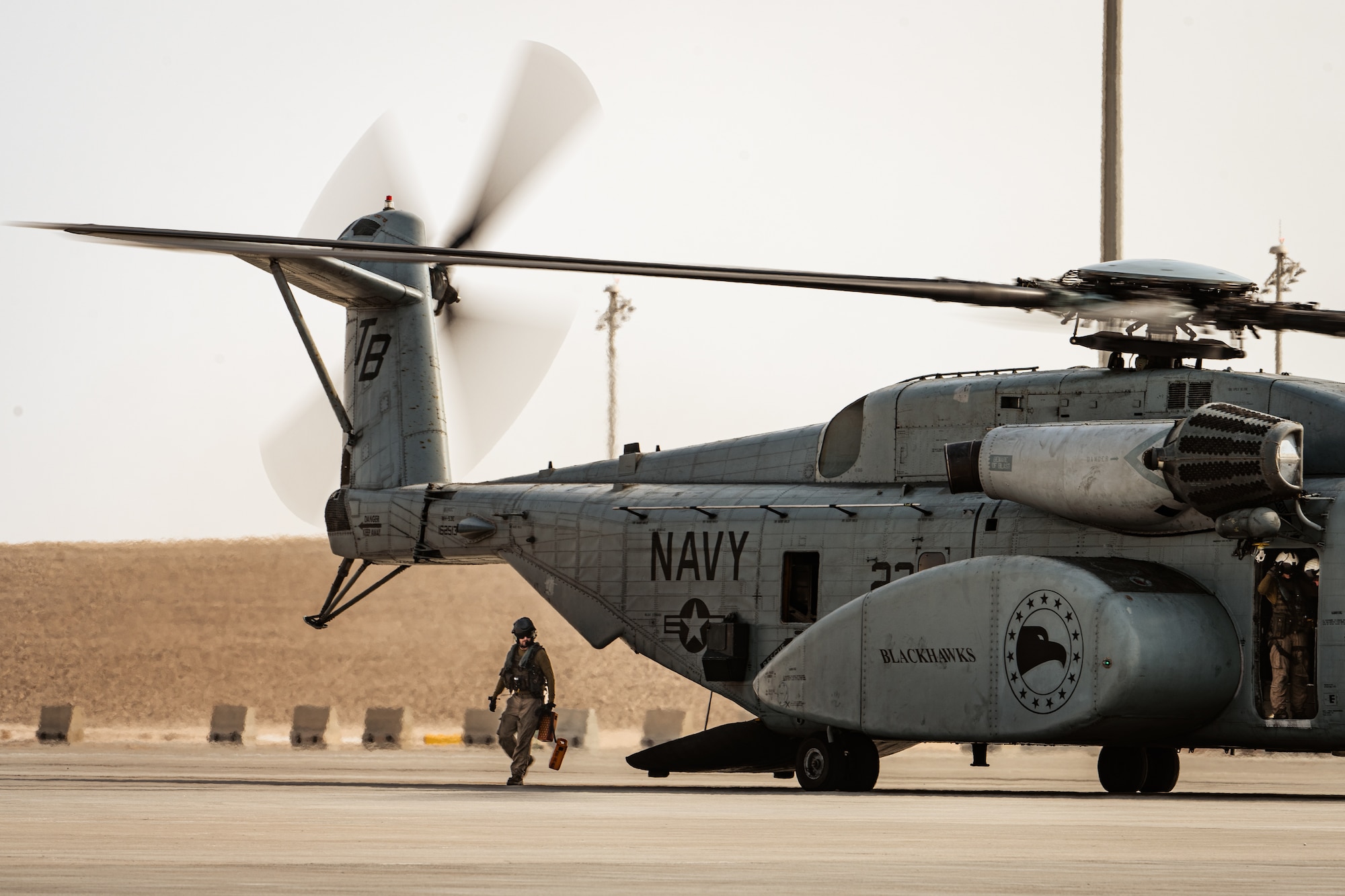 Photo of person stepping off a helicopter