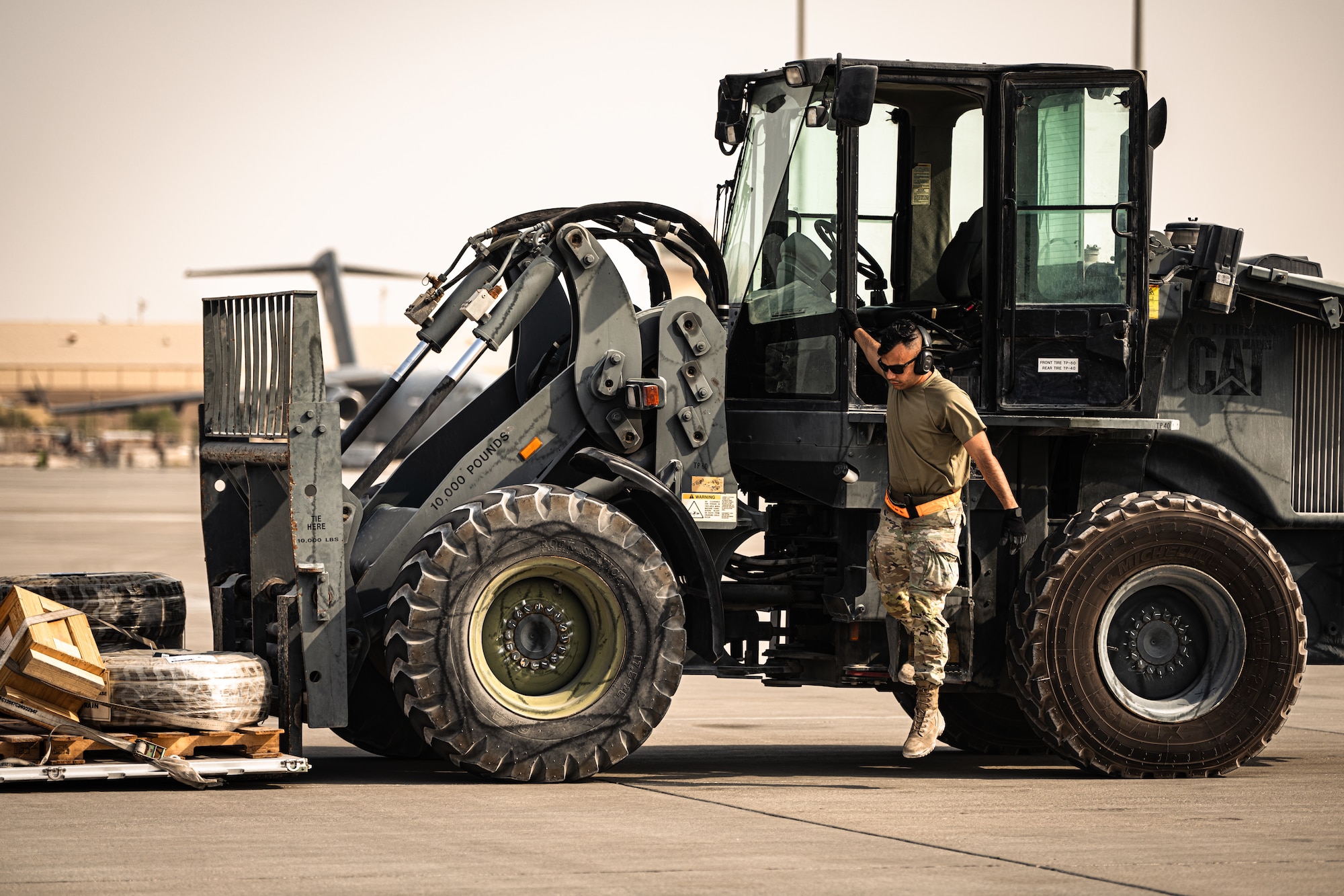 Photo of person stepping off a forklift