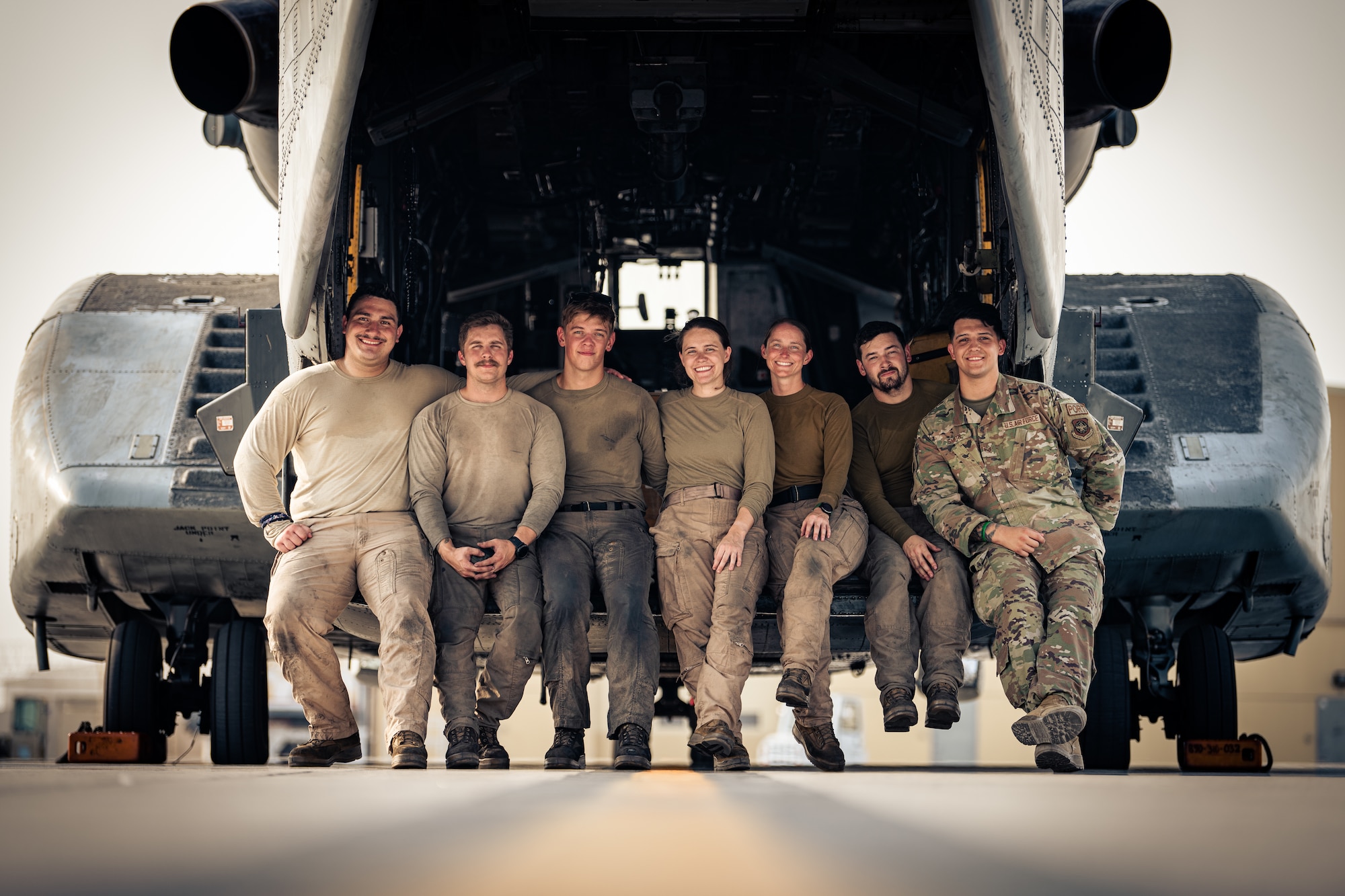 Photo of people sitting on the back of a helicopter