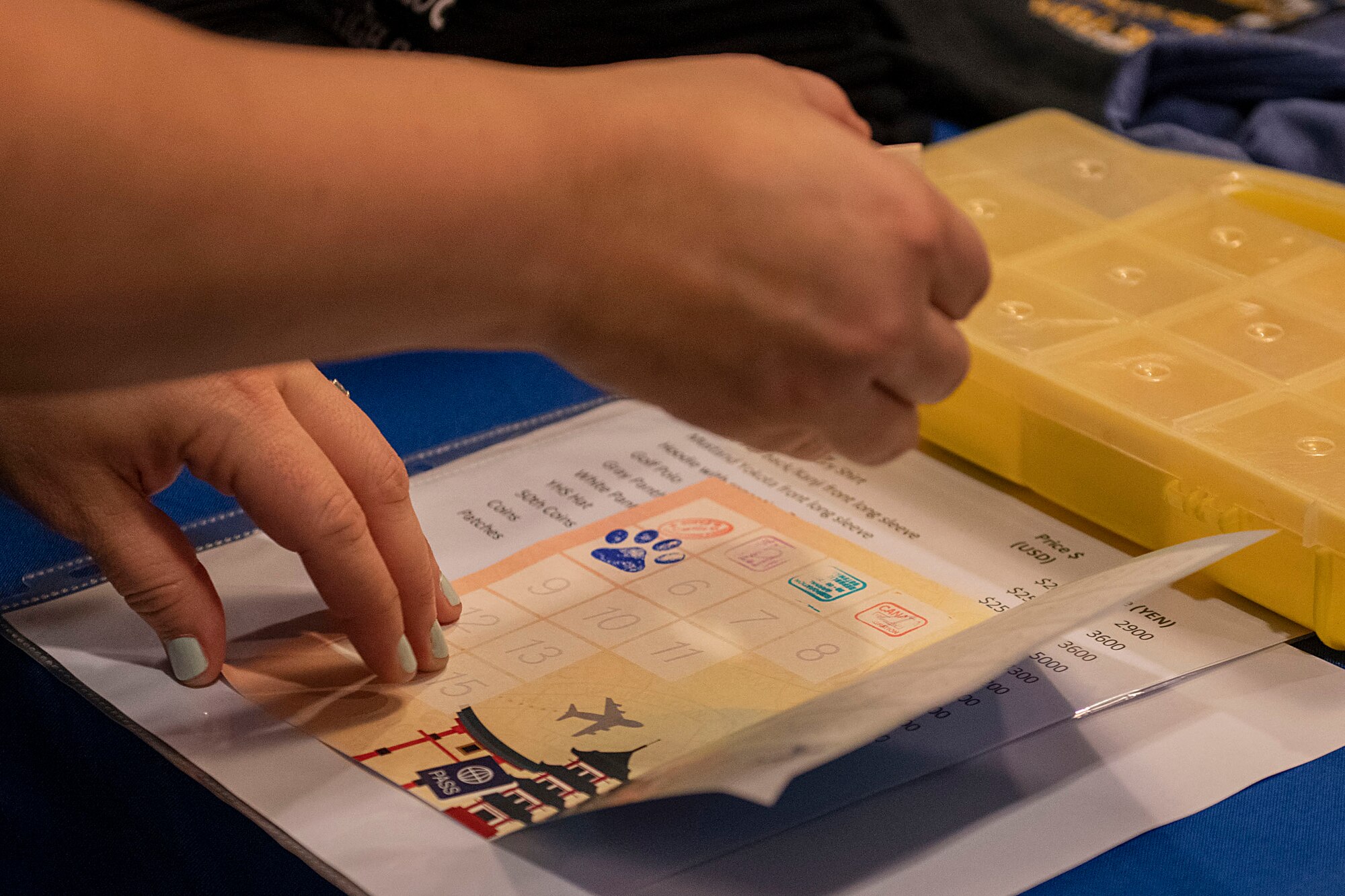 A passport is stamped on a table.