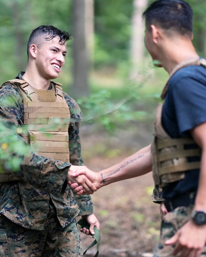 U.S. Marine Corporal Isay Baca (left), Sgt Elisha Fink (center) and Staff Sgt. Christian Dejesus (right) with U.S. Marine Corps Forces, Europe and Africa pose with their new Marine Corps Martial Arts Instructor (MAI) belts during a MAI course in Boblingen, Germany on Aug. 10, 2023. During MAI training, a diverse array of weapons can be employed to cultivate comprehensive combat skills, while also emphasizing rigorous physical conditioning. These encompass edged weapons like knives, bayonets, and combat blades, alongside impact weapons such as batons and improvised objects. The overarching goal of this training is to equip MAIs with proficiency in instructing Marines across a wide spectrum of weaponry, catering to various combat scenarios. (U.S. Marine Corps photo by Sgt. James Bourgeois)