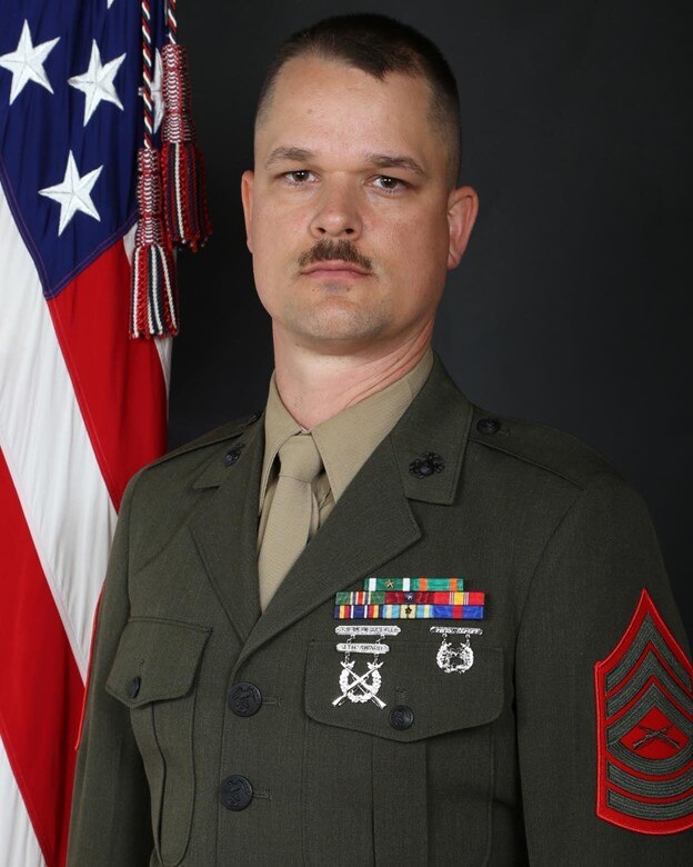 The official command photo of the Second Marine Division Band Instrument Repair Technician, Master Sergeant James K. Merville.