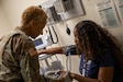 U.S. Army Reserve Maj. Beverly Lynch, a registered nurse assigned to the 7457th  Medical Operational Readiness Unit, Richmond, Va., conducts a vitals assessment of an employee during the National Capitol Region (NCR) Low Density Medical Skills Sustainment Training at the DiLorenzo Pentagon Health Clinic (DPHC), Washington, D.C., August 9, 2023.  Soldiers from the Army Reserve Medical Command (AR-MEDCOM), 807th Medical Command (Deployment Support) and 3rd MCDS echelons go on two-week rotations every year into the NCR to provide medical laboratory and medical logistical augmentation for the DPHC, the Fort Belvoir Community Hospital and Walter Reed Army Institute of Research. (U.S. Army Reserve photo by Staff Sgt. Christopher Hernandez)