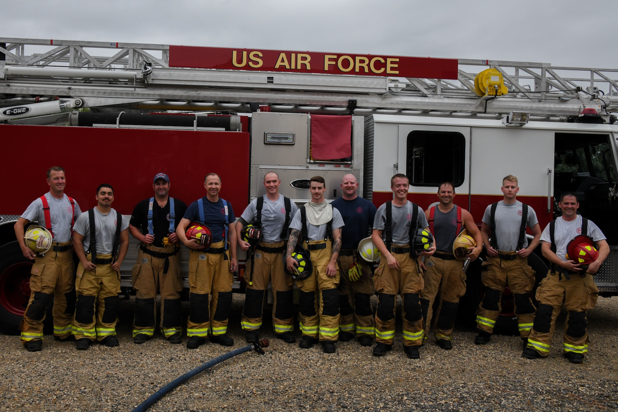 A group of firefighters pose for a picture.