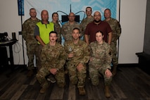 Members of Atomic Spark pose with their 2022 General Spencer Innovation Award at Minot Air Force Base, North Dakota, Aug. 14, 2023. Created out of the merger of the 5th Bomb Wing’s innovation cell BUFFWERX and the 91st Missile Wing’s innovation cell BULLYWERX, Atomic Spark is the first joint wing physical innovation cell in all of Air Force Global Strike Command.