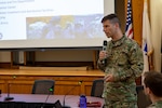 Lt. Col. Chris Elgee, team lead and cyber officer with the Massachusetts National Guard Joint Forces Headquarters, briefs leaders of the Guard and local and state officials on a cyber assessment of the Town of Tewksbury by the Massachusetts National Guard. Two Guard Soldiers and two Airmen worked with Tewksbury officials to identify weaknesses in their cybersecurity and suggest how it could be improved.