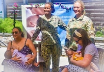 Chief of Staff of Walter Reed National Military Medical Center, Navy Capt. Dr. Kelly Elmore and Deputy Director of Nursing Services, Wendy Woodhall poses with Jenny Vasques Robles and Melanie Buzzelli both breastfeeding moms. Capt. Elmore also a cerfitied OBGYN was the guest speaker during the event to stress the importance of breastfeeding month, Aug. 18, 2022. (Photo by Alpha Kamara, Command Communications)