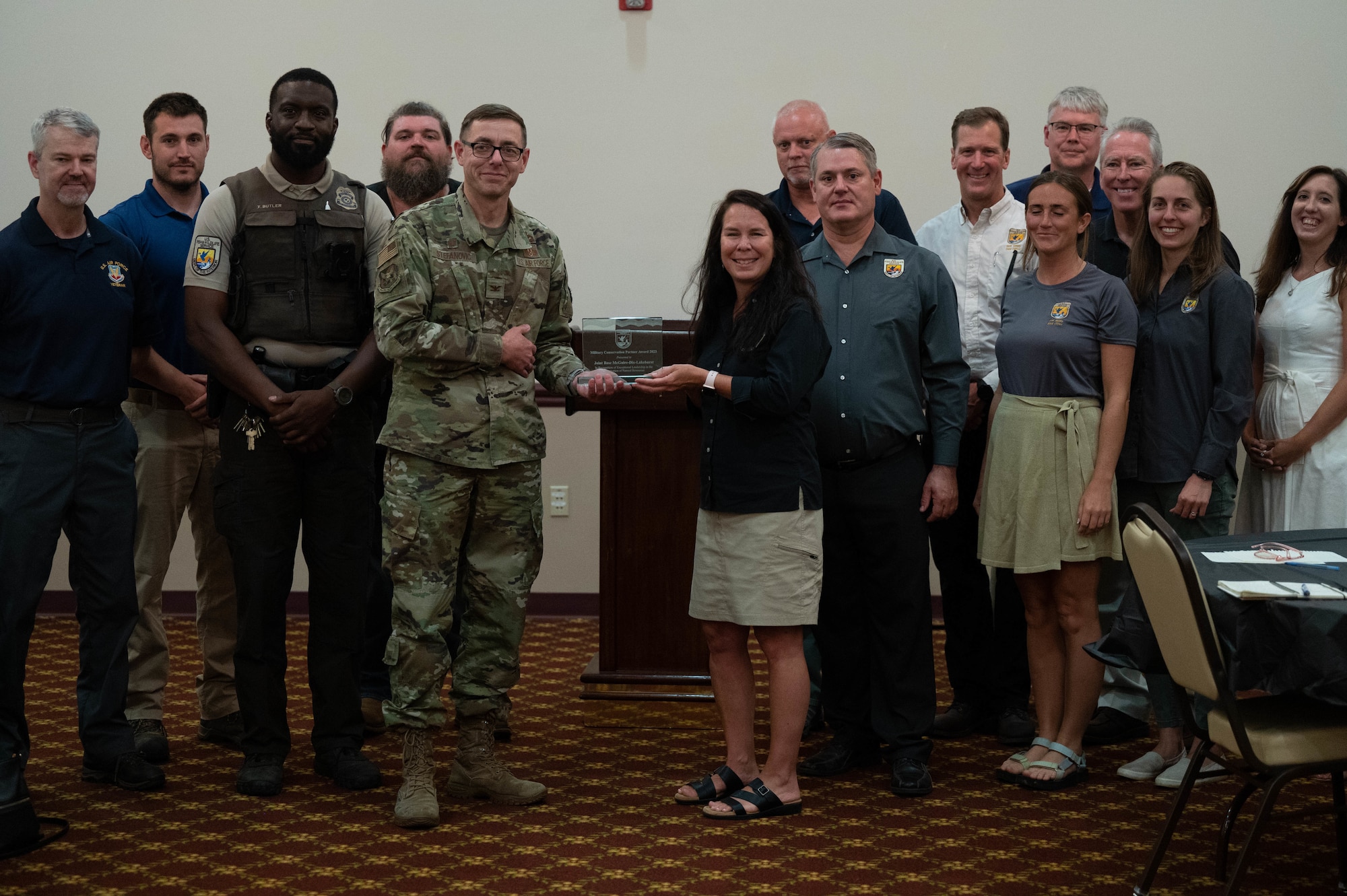 The group poses after accepting the Military Conservation Partner Award from Sharon Marino, assistant regional director for the Service’s Ecological Service’s program in the Northeast on Joint Base McGuire-Dix-Lakehurst, N.J., August 14, 2023. Joint Base McGuire Dix Lakehurst was named the U.S. Fish and Wildlife Service’s 19th Annual Military Conservation Partner Award for its outstanding contributions to natural resource management (U.S. Air Force photo by Senior Airman Faith Iris MacIlvaine)