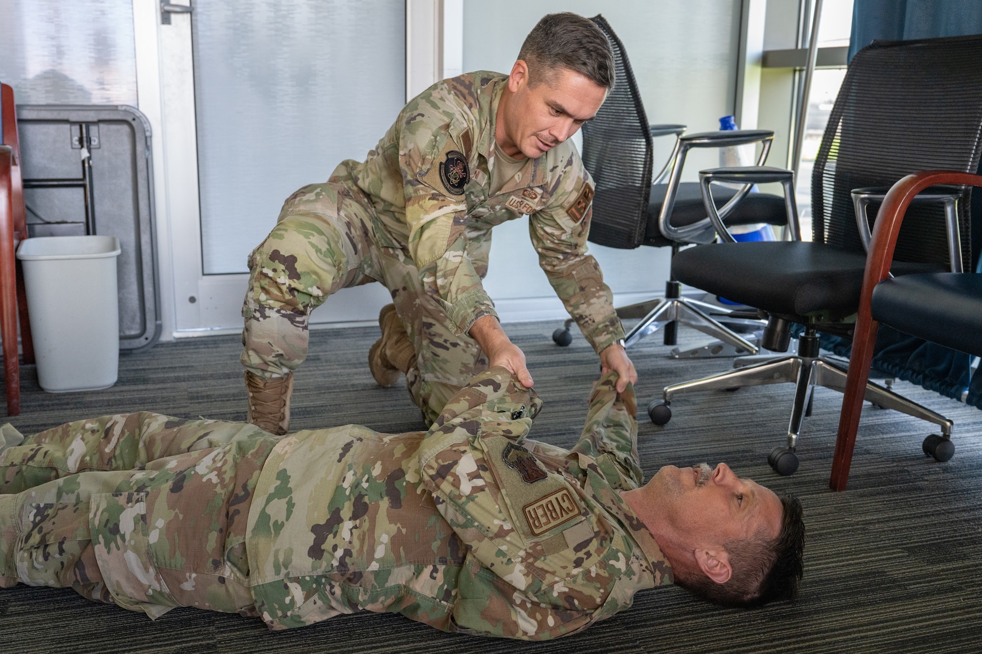U.S. Air Force Staff Sgt. Layman Franklin, 709th Cyberspace Squadron support center noncommissioned officer in charge, teaches a Tactical Combat Casualty Care class at Patrick Space Force Base, Florida, Aug. 15, 2023. Franklin had his students run through the Massive Bleeding, Airway, Respiration, Circulation, and Hypothermia steps (MARCH) to ensure proper understanding of the protocol. (U.S. Space Force photo by Senior Airman Dakota Raub)