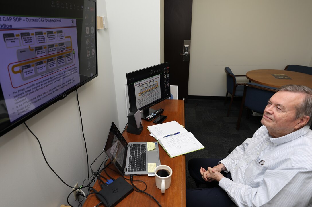 U.S. Army Corps of Engineers (USACE) Galveston District Internal Review (IR) Chief Bert Hervey virtually attends a Dept. of the Army IR symposium in his office at District Headquarters, Aug. 11, 2023. The symposium spanned four days, with topics aimed at improving Regulatory Internal Controls and providing audits and corrective action for deficiencies created by the pandemic.