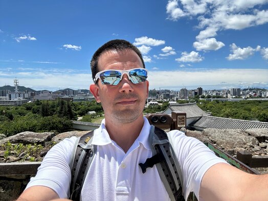 U.S. Space Force Major Lee Schroeder poses in front of Himeji Castle in Japan Jul. 2023. Schroeder credits his military service with his love for learning about new cultures and history. (Courtesy Photo)