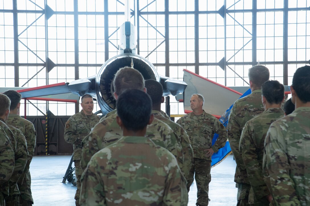 Chief Master Sgt. Randal Brooks, the 362d Training Squadron Senior Enlisted Leader, announces Chief Master Sgt. Jason Howard's promotion at Sheppard Air Force Base, Texas, August, 4, 2023. Howard is an Airman in training with the 362d TRS for MQ-9 maintenance training. (U.S. Air Force photo by Airman 1st Class Katie McKee)