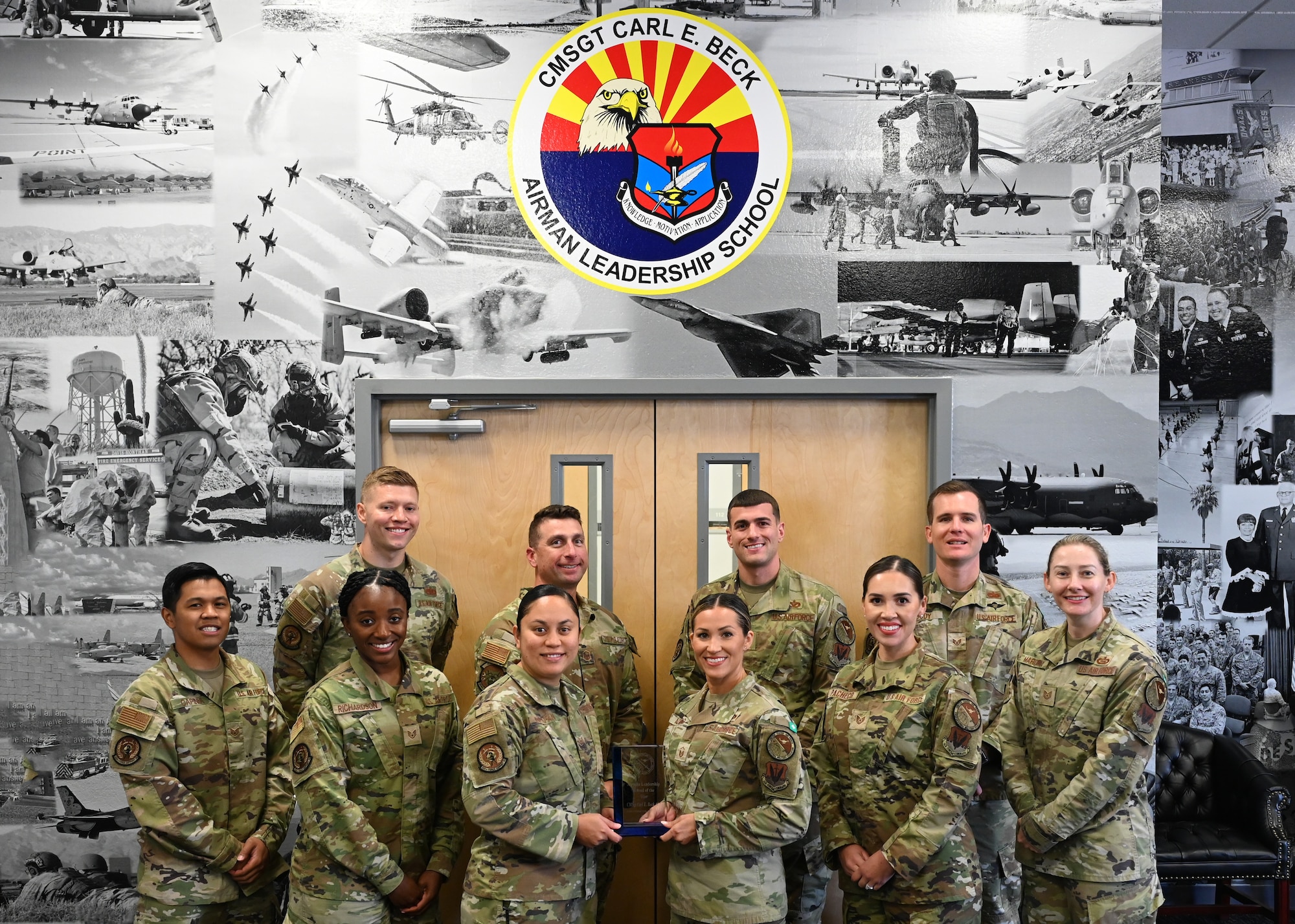 The 355th Force Support Squadron Chief Master Sgt. Carl E. Beck Airman Leadership School cadre, team together at Davis-Monthan Air Force Base, Aug. 14, 2023. The Davis-Monthan ALS schoolhouse was named best in the Air Force for 2022 on Aug. 6, 2023. (U.S. Air Force photo by Staff Sgt. Abbey Rieves)