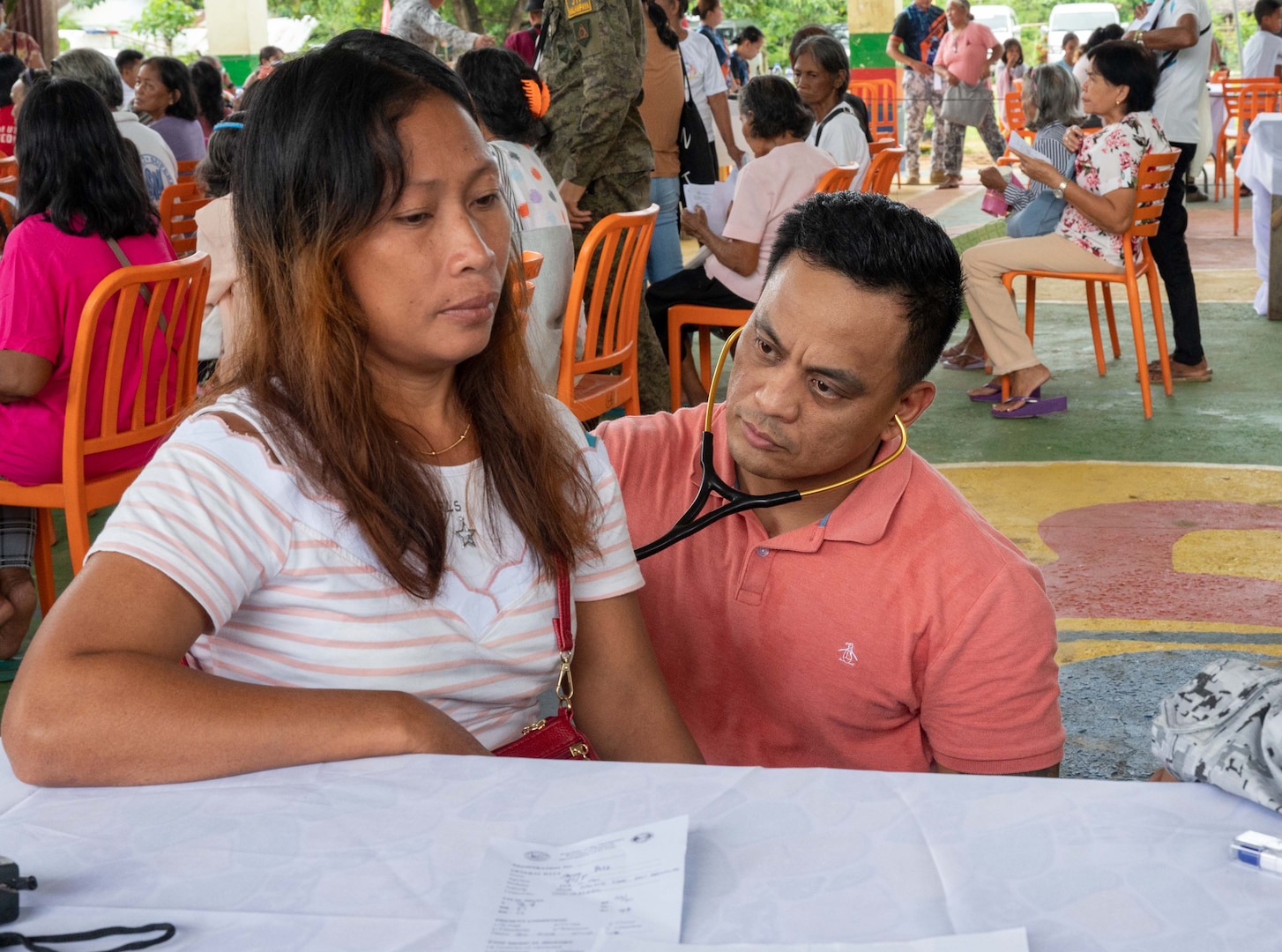 Lt. Cmdr. Alvaro Ramos, the physician associate for a U.S. Naval Special Warfare unit, conducts a medical consultation for local nationals during a medical civic action program hosted by members of a U.S. NSW unit and U.S. Civil Affairs in Palawan, Philippines, July 30, 2023. Special Warfare is the nation’s elite maritime special operations force, uniquely positioned to extend the Fleet’s reach and gain and maintain access for the Joint Force in competition and conflict. (U.S. Navy Photo by Mass Communication Specialist 1st Class Daniel Gaither)