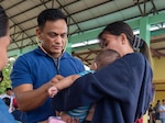 Lt. Cmdr. Alvaro Ramos, the physician associate for a U.S. Naval Special Warfare unit, conducts a medical consultation for an infant during a medical civic action program hosted by members of a U.S. NSW unit and U.S. Civil Affairs in Palawan, Philippines, July 29, 2023. Naval Special Warfare is the nation’s elite maritime special operations force, uniquely positioned to extend the Fleet’s reach and gain and maintain access for the Joint Force in competition and conflict. (U.S. Navy Photo by Mass Communication Specialist 1st Class Daniel Gaither)