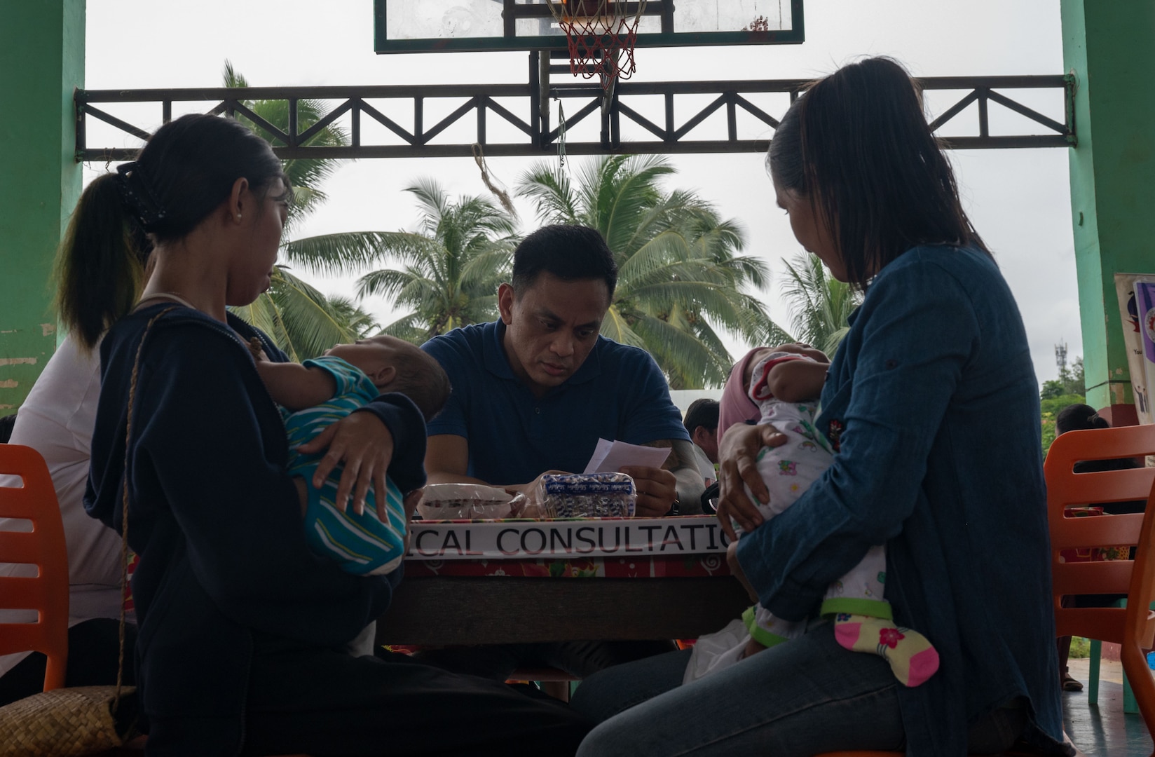 Lt. Cmdr. Alvaro Ramos, the physician associate for a U.S. Naval Special Warfare unit, conducts a medical consultation for local nationals during a medical civic action program hosted by members of a U.S. NSW unit and U.S. Civil Affairs in Palawan, Philippines, July 29, 2023. Naval Special Warfare is the nation’s elite maritime special operations force, uniquely positioned to extend the Fleet’s reach and gain and maintain access for the Joint Force in competition and conflict. (U.S. Navy Photo by Mass Communication Specialist 1st Class Daniel Gaither)