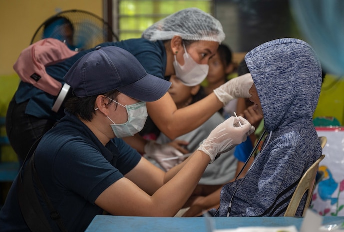 Medical professionals from the Palawan Dental Chapter apply fluoride and provide oral care for local children during a medical civic action program hosted by members of a U.S. Naval Special Warfare unit and U.S. Civil Affairs in Palawan, Philippines, July 29, 2023. Naval Special Warfare is the nation’s elite maritime special operations force, uniquely positioned to extend the Fleet’s reach and gain and maintain access for the Joint Force in competition and conflict. (U.S. Navy Photo by Mass Communication Specialist 1st Class Daniel Gaither)