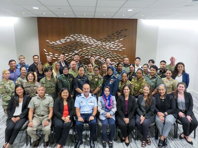 HONOLULU (Aug. 14, 2023) Air Commodore Chris Robson, US Indo-Pacific Command, Deputy Director for Strategy and Senior Women, Peace, and Security (WPS), takes a photo with participants from 11 partner nations (Australia, Bangladesh, Canada, Fiji, Japan, Malaysia, Mongolia, New Zealand, Papua New Guinea, the Philippines, and Thailand) at the inaugural, Indo-Pacific Regional Military Gender Advisor Course. The course is part of a 5-year initiative to develop a network of certified military Gender Advisors within the Indo-Pacific. (U.S. Navy photo by Commander Matthew P. Galan)
