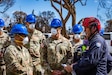 Soldiers speak with local search, rescue and recovery personnel after wildfires in Maui, Hawaii.
