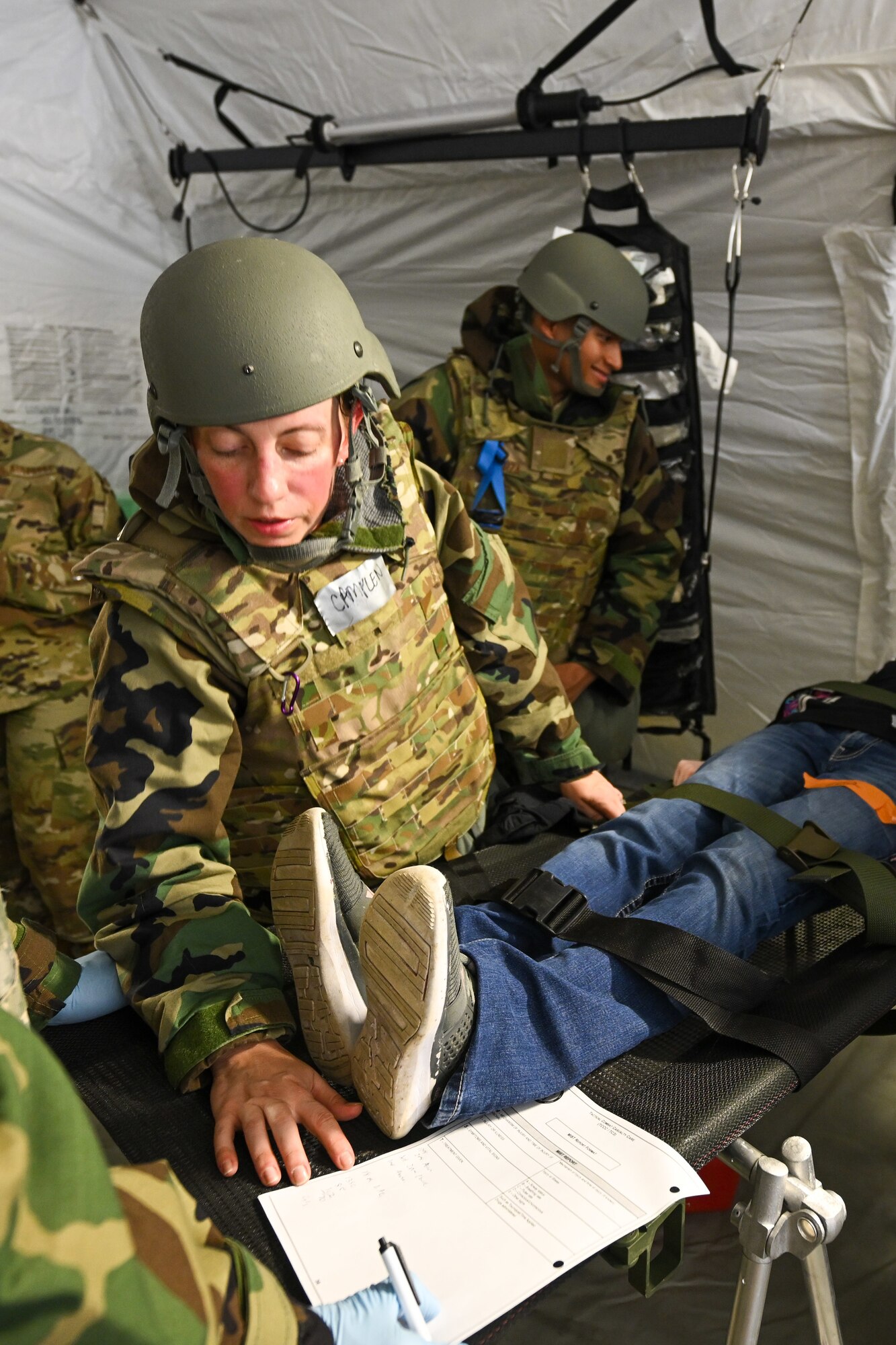 Maj. Kathryn Camplen, a member of the 433rd Medical Group at Joint Base San Antonio-Lackland, Texas, reviews patient information while providing emergency care at Youngstown Air Reserve Station, Ohio, Aug. 16, 2023.