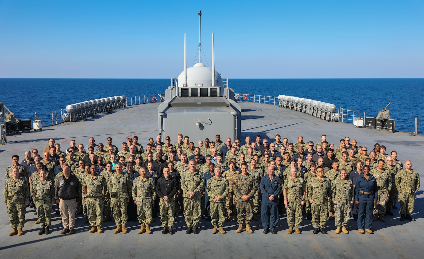 230810-N-JM579-1048 MEDITERREAN SEA (August 10, 2023) U.S. 6th Fleet headquarters staff stand in formation for group photo aboard the Blue Ridge-class command and control ship USS Mount Whitney (LCC 20), Aug. 10, 2023. Mount Whitney is participating in Large Scale Exercise 2023 from Aug. 9-18, which is a live, virtual, and constructive, globally-integrated exercise designed to refine the synchronization of maritime operations across six maritime component commands, seven numbered fleets, and 22 time zones. (U.S. Navy photo by Mass Communication Specialist Seaman Joseph Macklin)