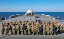 230810-N-JM579-1048 MEDITERREAN SEA (August 10, 2023) U.S. 6th Fleet headquarters staff stand in formation for group photo aboard the Blue Ridge-class command and control ship USS Mount Whitney (LCC 20), Aug. 10, 2023. Mount Whitney is participating in Large Scale Exercise 2023 from Aug. 9-18, which is a live, virtual, and constructive, globally-integrated exercise designed to refine the synchronization of maritime operations across six maritime component commands, seven numbered fleets, and 22 time zones. (U.S. Navy photo by Mass Communication Specialist Seaman Joseph Macklin)