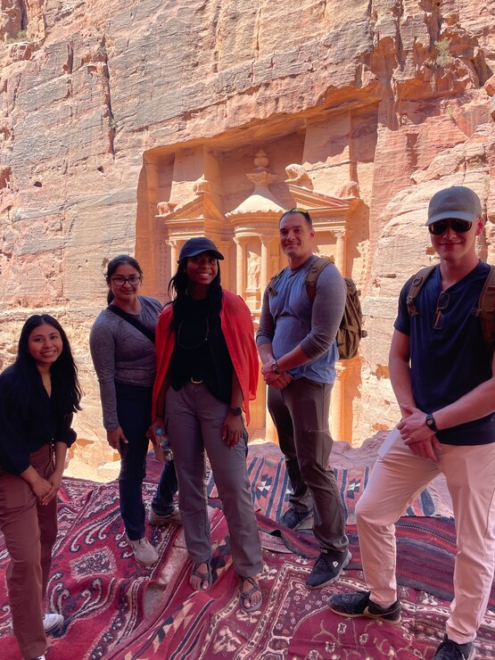 Group of people in front of historical monument