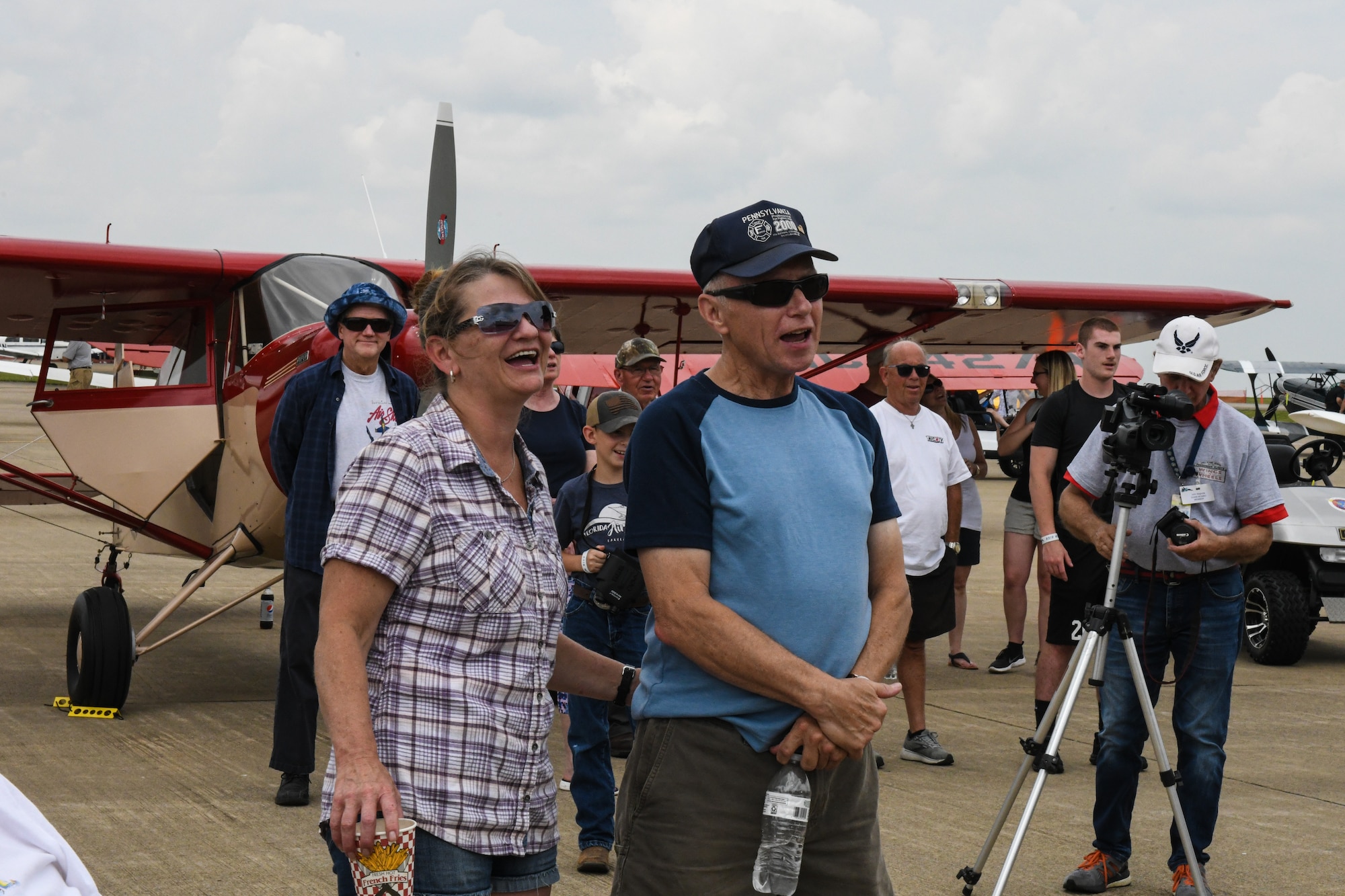 Event guests sing “Happy Birthday” to celebrate the Air Force Reserve’s 75th birthday, Aug. 6, 2023, at the Wings and Wheels Fly-In and Car Show at Youngstown-Warren Regional Airport, Ohio.