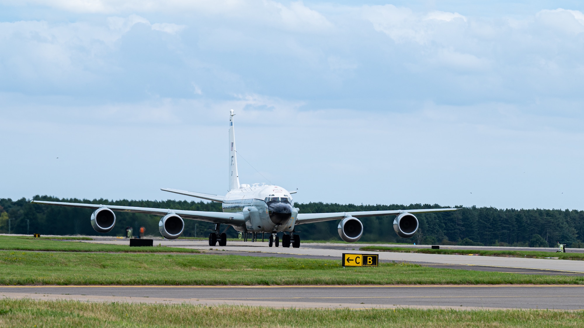 A U.S. Air Force RC-135 Rivet Joint aircraft, assigned to the 95th Reconnaissance Squadron, taxis on the flightline to begin the first hot-pit refueling mission for the airframe at Royal Air Force Mildenhall, England, Aug. 14, 2023.