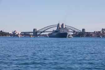 San Antonio-class amphibious transport dock USS Green Bay (LPD 20) sails into Sydney Harbor during a ceremonial fleet entry in Sydney, Australia, during Exercise Malabar 2023, August 11.
