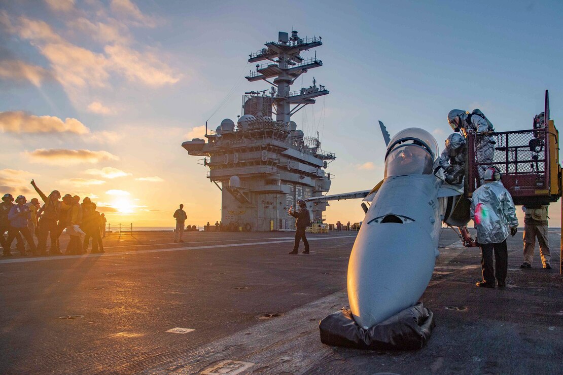 Sailors participate in a firefighting drill on the flight deck of aircraft carrier USS Nimitz (CVN 68).