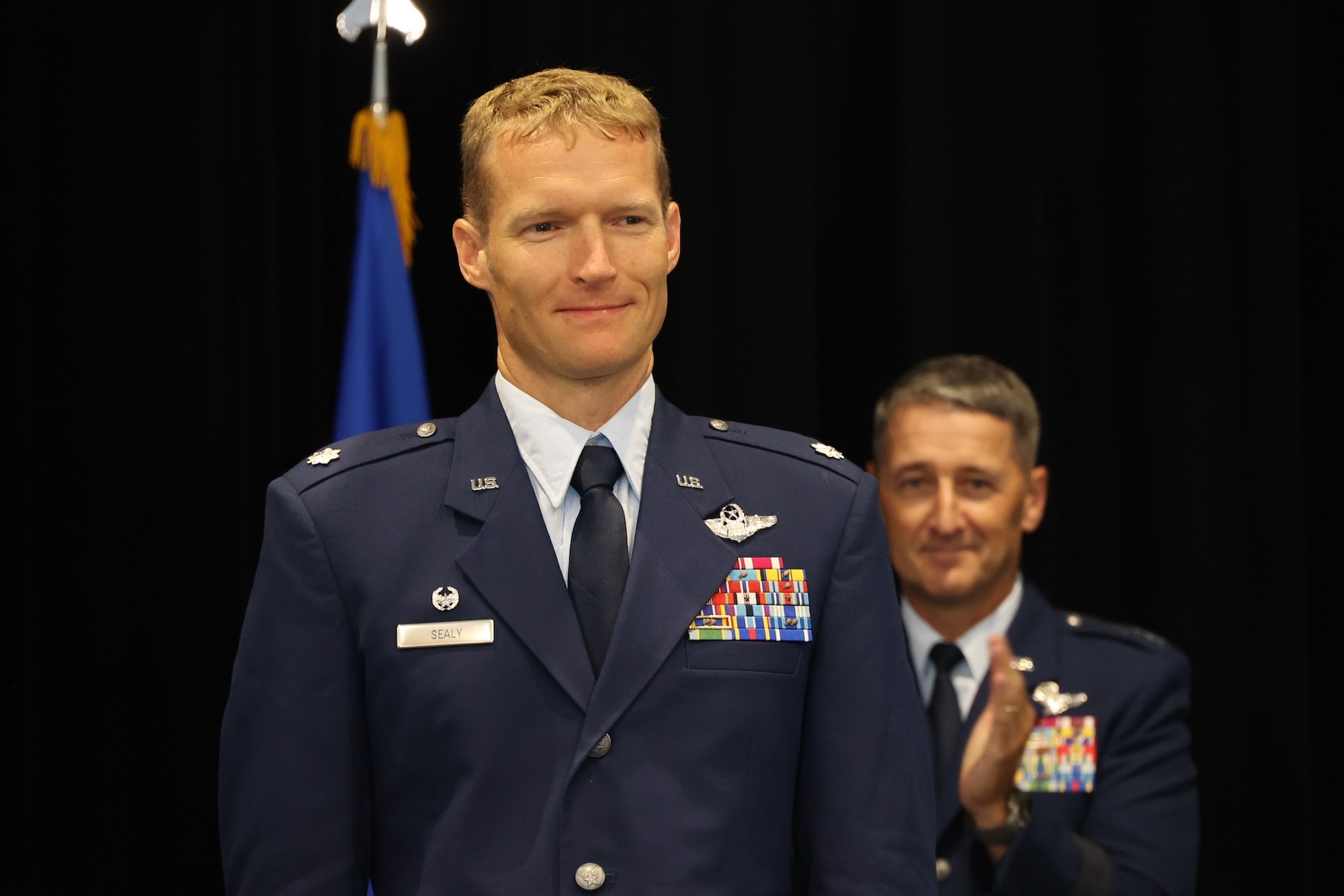 Photos show the passing of the guidon from the outgoing to the incoming AFRCC commander. The Air Force Rescue Coordination Center here held a change of command ceremony on August 1, 2023. Lt. Col. Matthew Mustain relinquished command to Lt. Col. Ryan Sealy. Lt. Gen. Nordhaus, commander of the Continental U.S. North American Aerospace Defense Region – First Air Force (Air Forces Northern and Air Forces Space) presided over the ceremony.