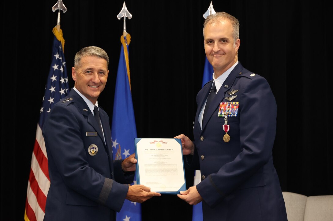 Photos show the passing of the guidon from the outgoing to the incoming AFRCC commander. The Air Force Rescue Coordination Center here held a change of command ceremony on August 1, 2023. Lt. Col. Matthew Mustain relinquished command to Lt. Col. Ryan Sealy. Lt. Gen. Nordhaus, commander of the Continental U.S. North American Aerospace Defense Region – First Air Force (Air Forces Northern and Air Forces Space) presided over the ceremony.