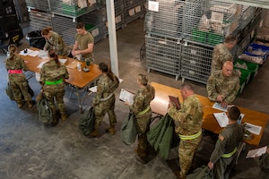 Airmen from the 167th Airlift Wing procure their mission oriented protective posture gear during a readiness exercise at the 167th Airlift Wing, Martinsburg, West Virginia, Aug, 9, 2023.