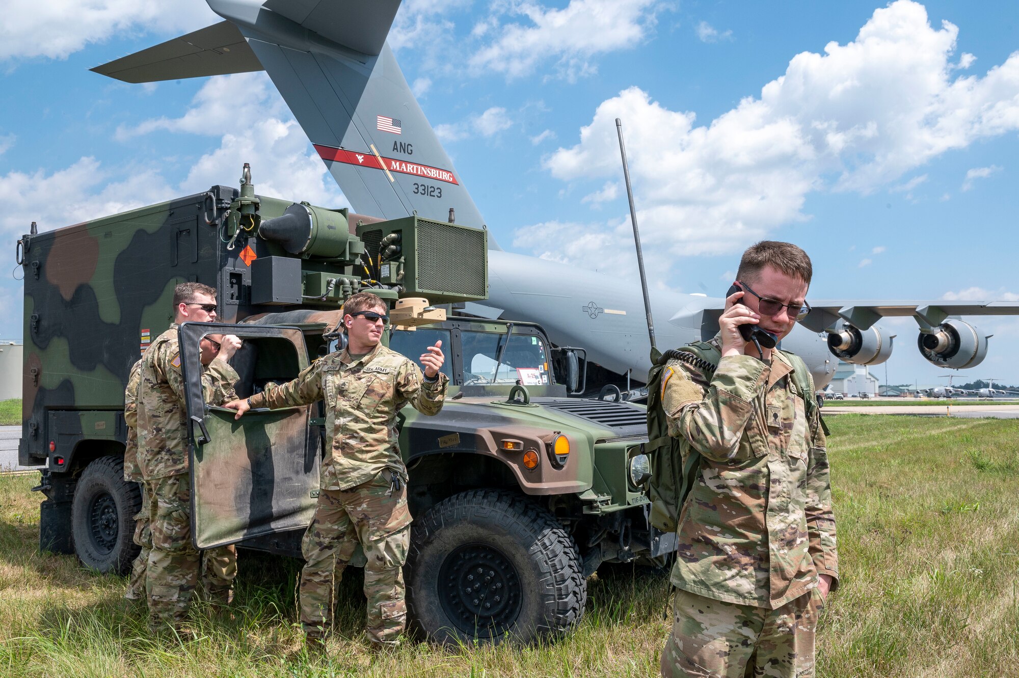 North Carolina National Guard Soldiers with 5th Battalion, 113th Field Artillery, maintain communications during a High Mobility Artillery Rocket System (HIMARS) training event as part of a readiness exercise for the 167th Airlift Wing, Shepherd Field, Martinsburg, West Virginia.