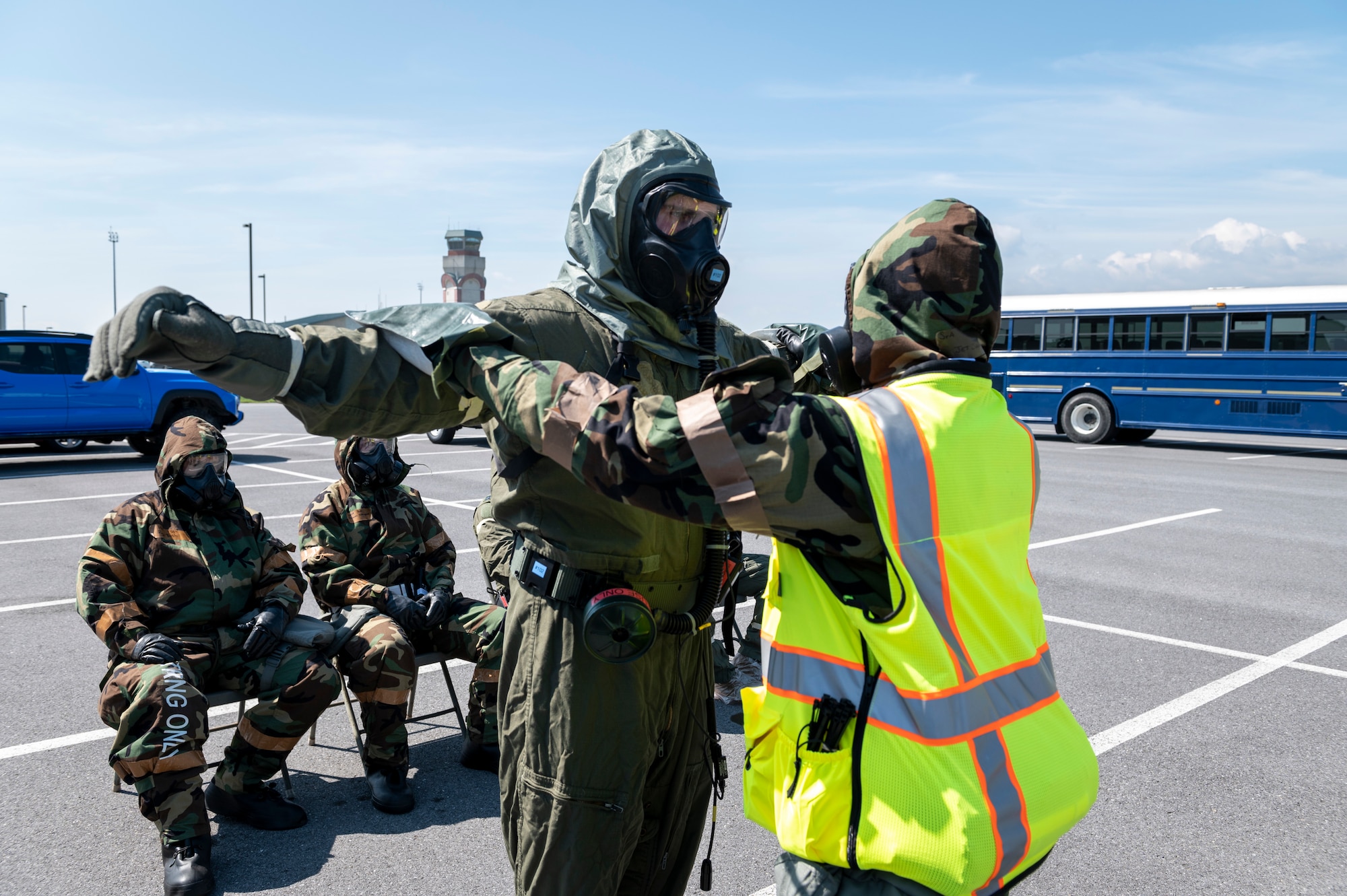 167th Aircrew Flight Equipment specialists simulate mitigating chemical contamination with 167th Aircrew members Group in an aircrew contamination control area (ACCA) as part of a training during a readiness exercise at the 167th Airlift Wing, Martinsburg, West Virginia, Aug. 12, 2023